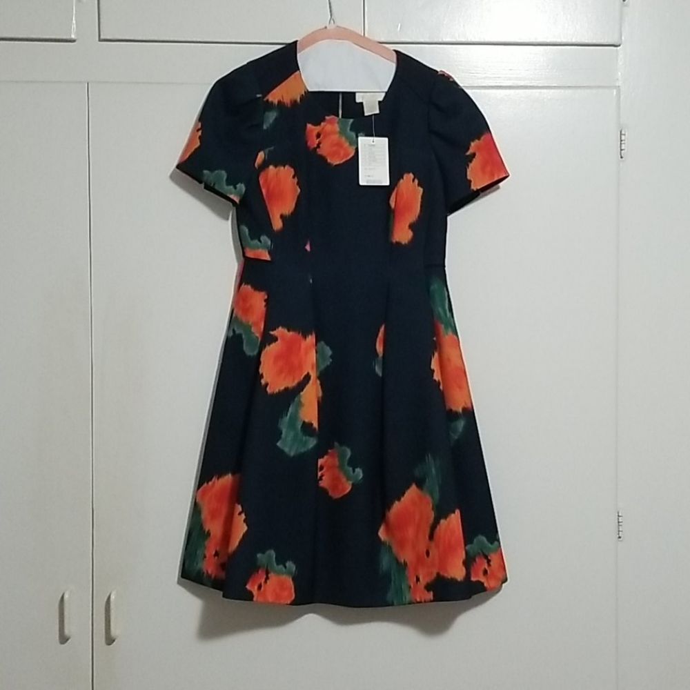 Navy Anthropologie dress with bright orange flower